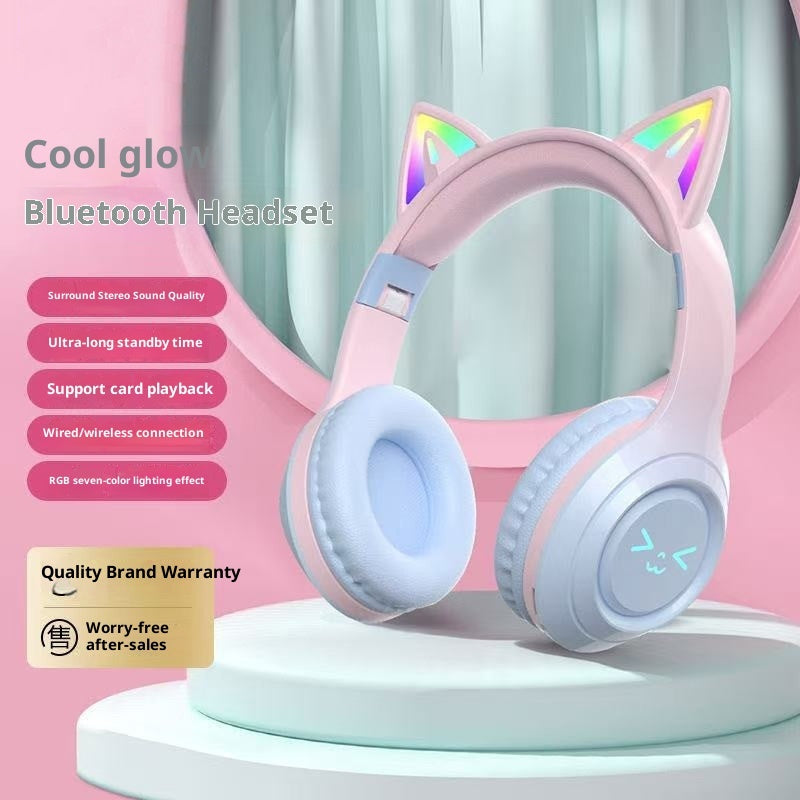 Pink Bluetooth headset with cat ears on a pink background