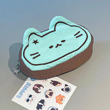 Cute cat-shaped pencil case with a set of stickers on a gray surface