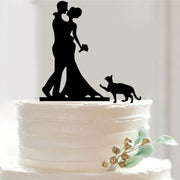Silhouette of a couple with a dog on a wedding cake against a white background