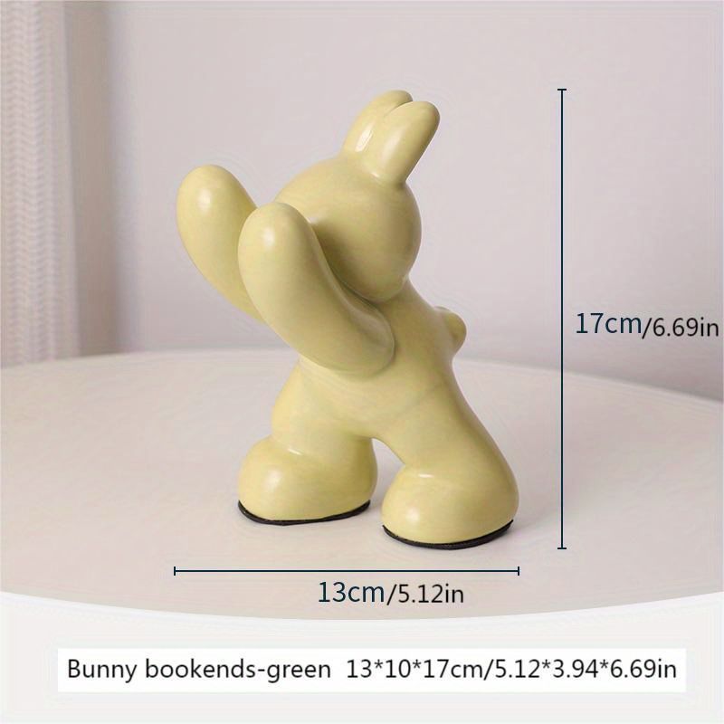 Yellow bunny bookend with dimensions on a white surface