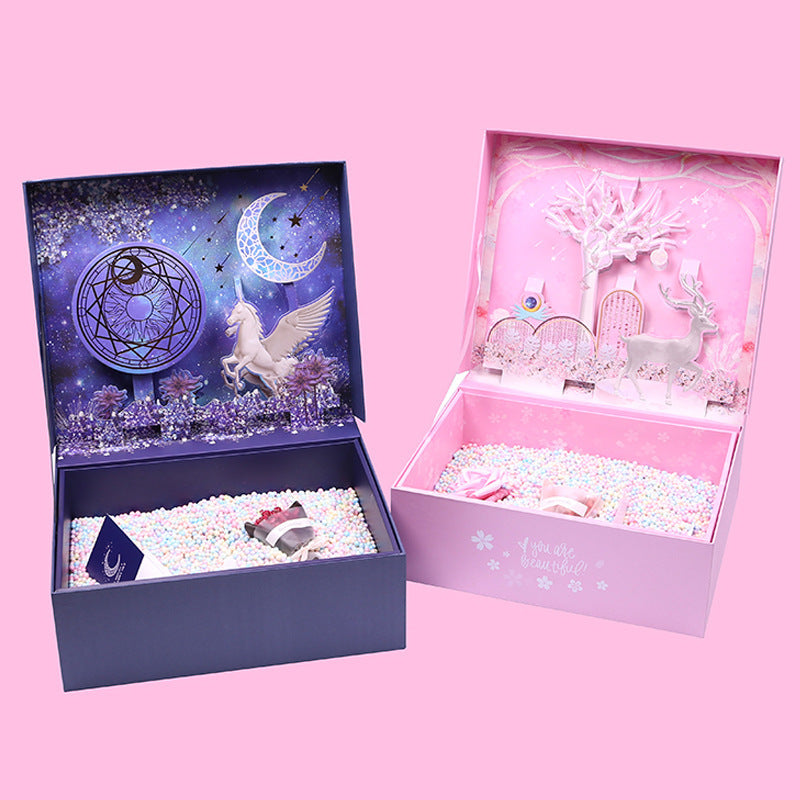 Two decorative boxes with fantasy designs on a pink background