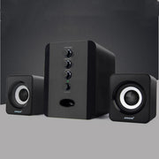 Black computer speakers with control buttons on a gray background