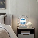 Decorative lamp on a nightstand next to a bed with a neutral color scheme