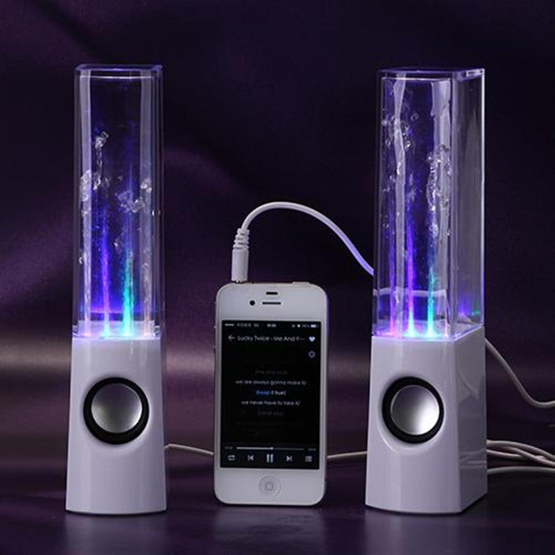 Two water fountain speakers with LED lights and a smartphone connecting them on a dark background.