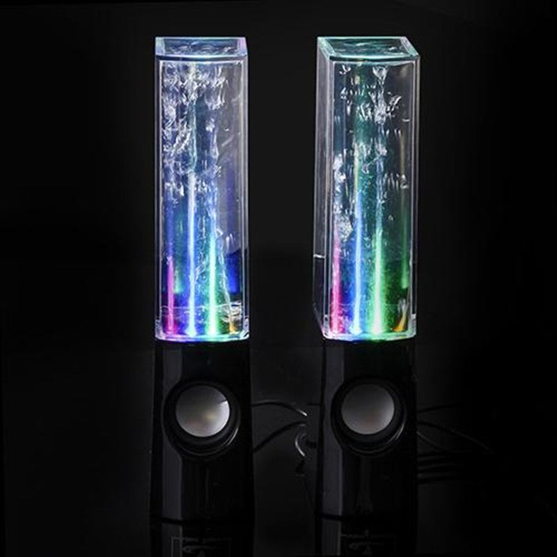 Pair of colorful water lamp speakers on a black background