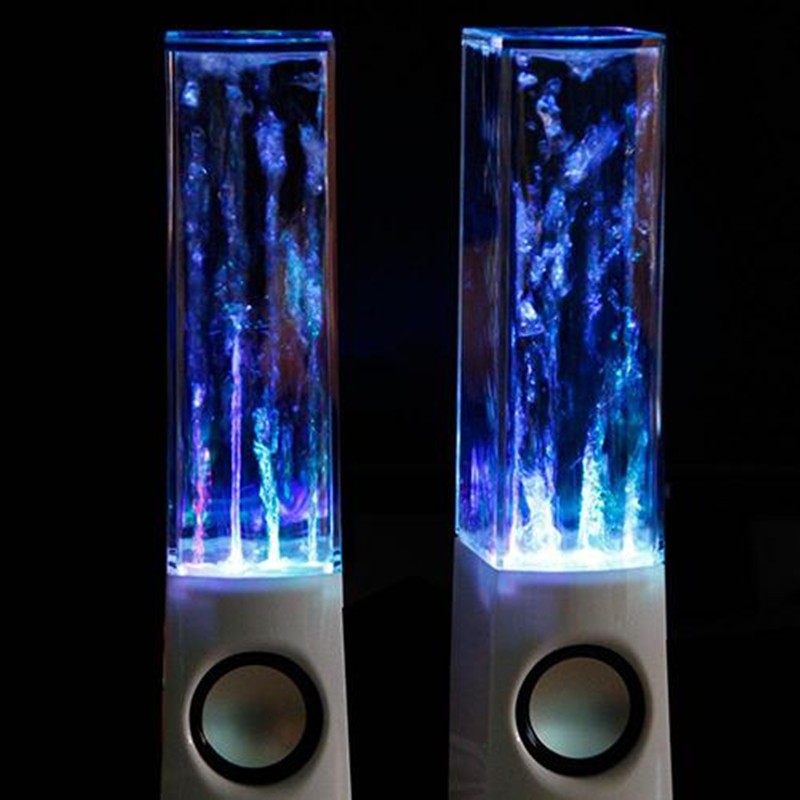 Two LED water lamp speakers with colorful light effects on a black background