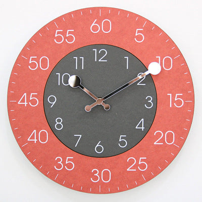 Round wall clock with a red outer rim and black center on a white background