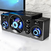 Black audio system with blue LED lights on a white surface.