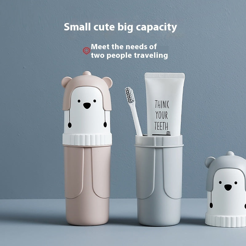 Travel-sized dental care set with bear-themed containers on a blue background