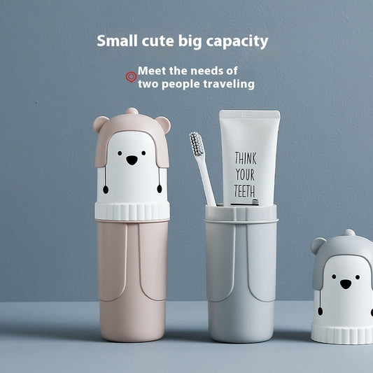 Travel-sized dental care set with bear-themed containers on a blue background