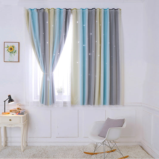 Striped curtains in a room with a chair and table.