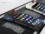 Phone with game controller attachment on a textured surface