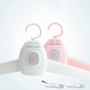 Two electronic hangers with pink and white designs on a white background