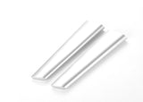 Two white cylindrical objects on a white background
