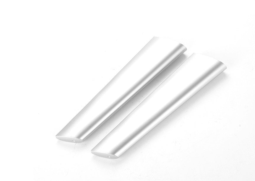 Two white cylindrical objects on a white background