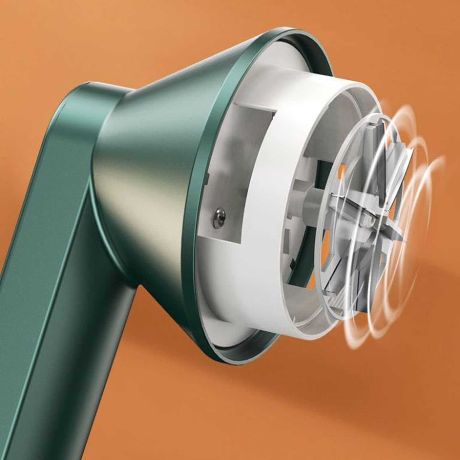 Close-up of a green hair dryer on an orange background