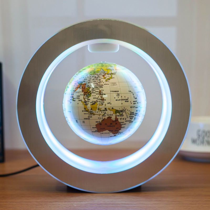Globe with LED light on a wooden surface