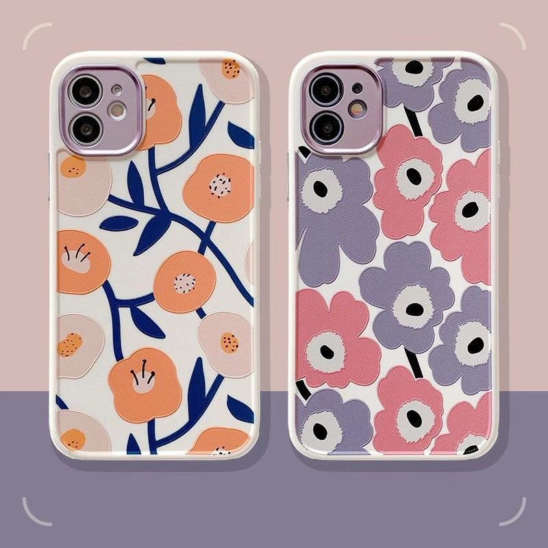Two floral phone cases on a gradient background