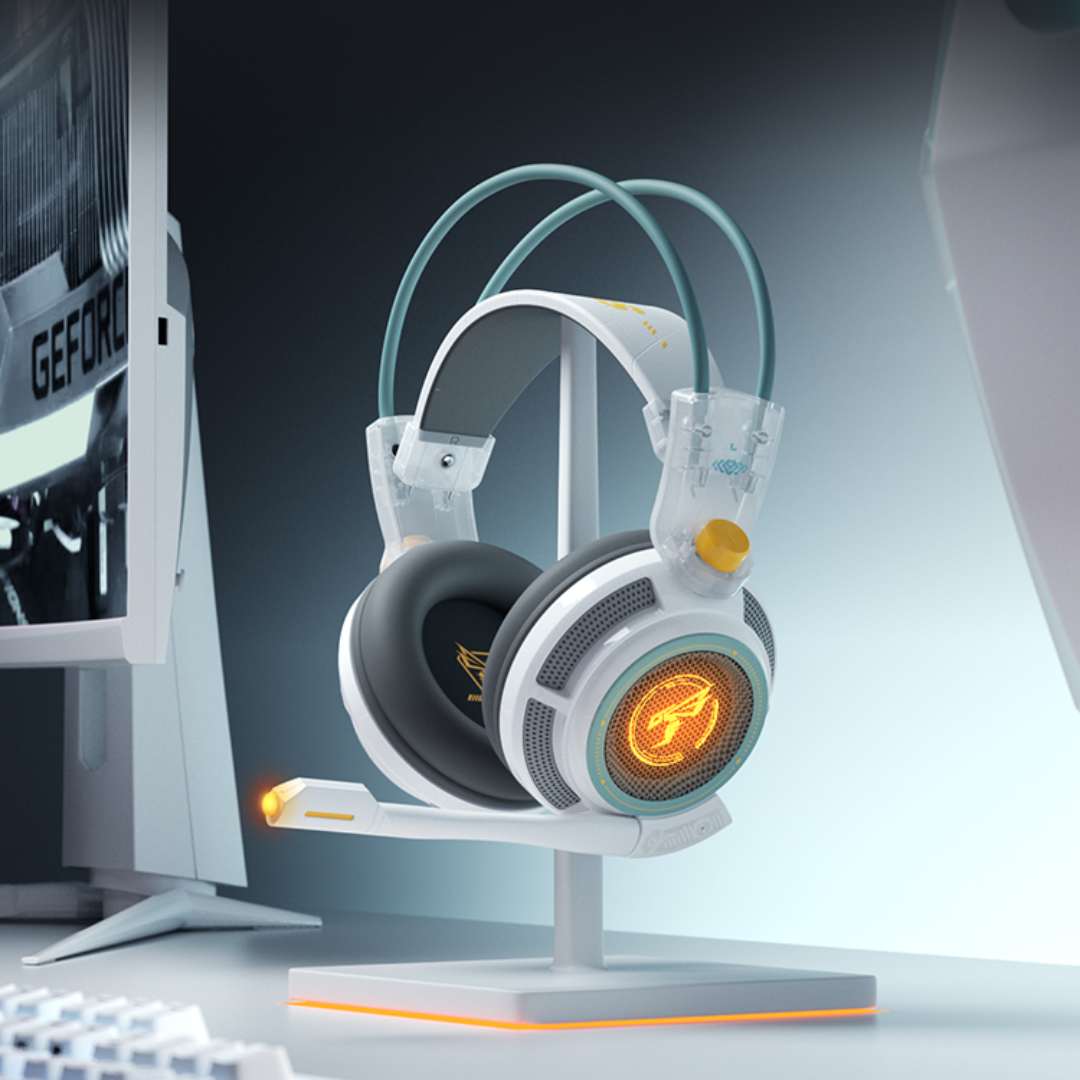 Gaming headset on a stand with a computer monitor in the background
