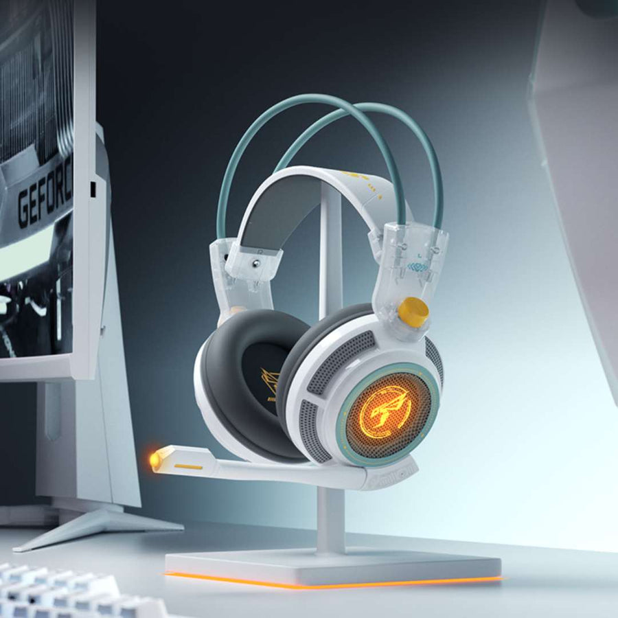 Gaming headset on a stand with a computer monitor in the background