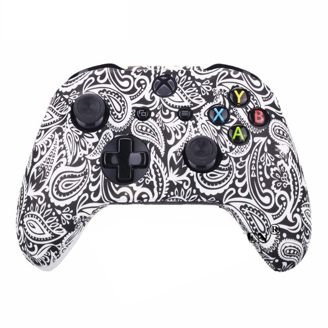 Gaming controller with black and white paisley pattern on a white background