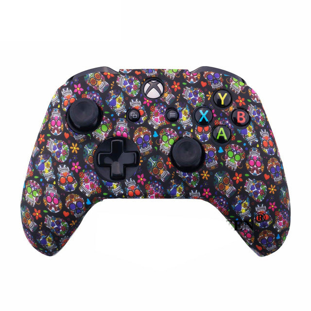 Gaming controller with colorful skull and flower pattern on a white background