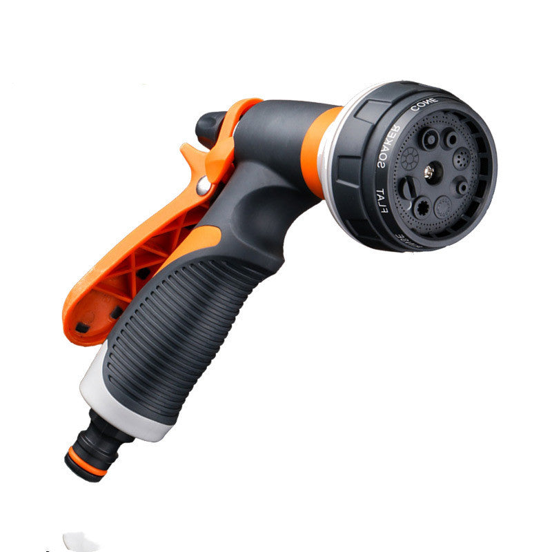 Garden hose nozzle with orange and black design on a white background