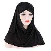 Black hijab on a mannequin head with a white background