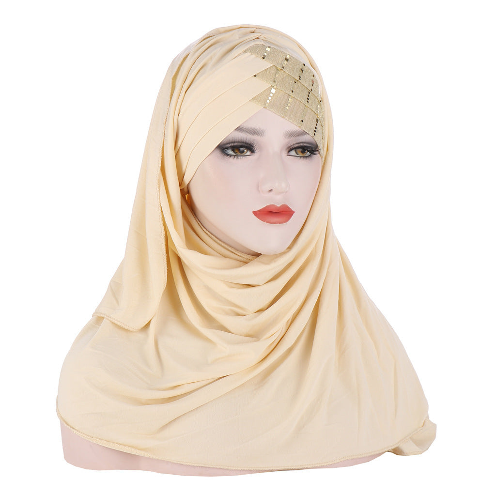 Beige hijab worn by a mannequin head on a white background