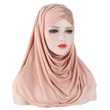 Pink hijab with embellishments on a white background
