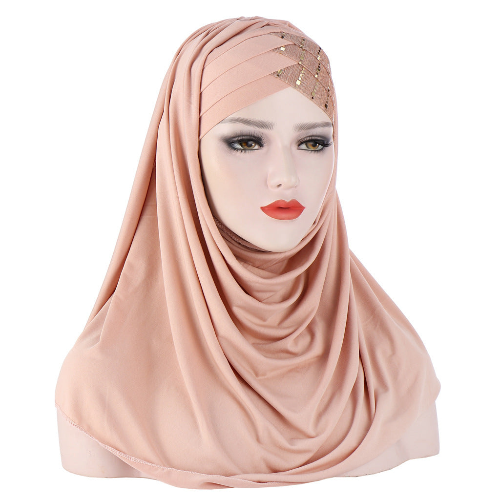 Pink hijab with embellishments on a white background
