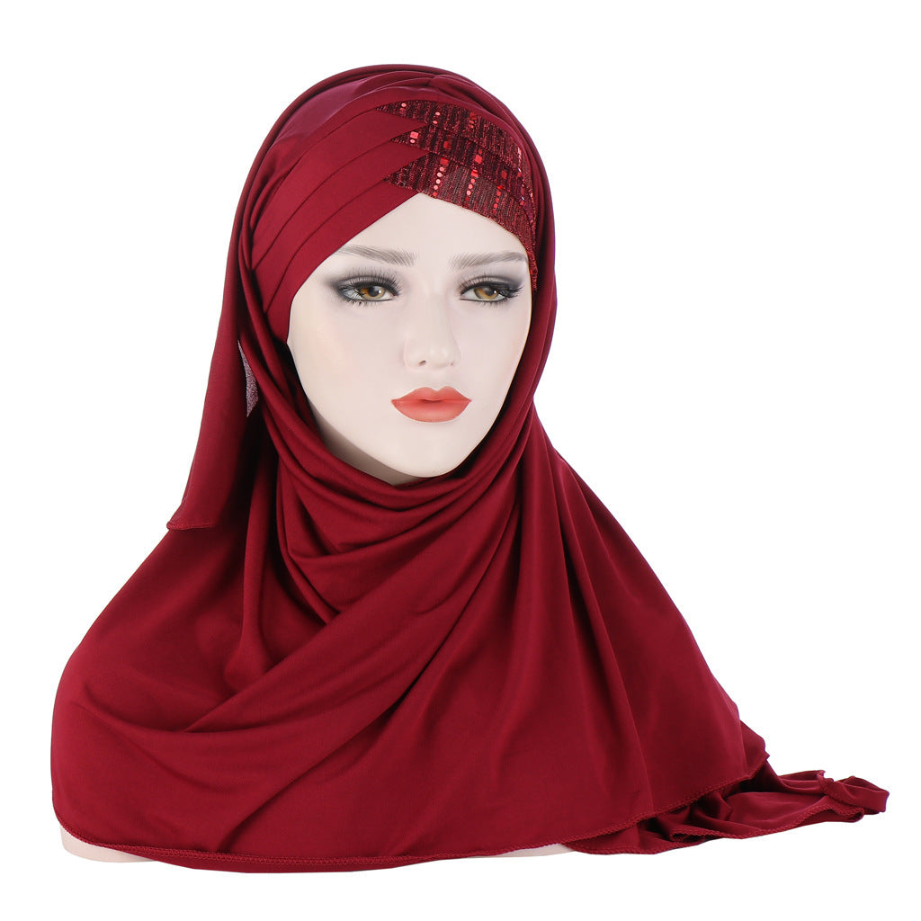 Red hijab with sequin embellishments on a white background