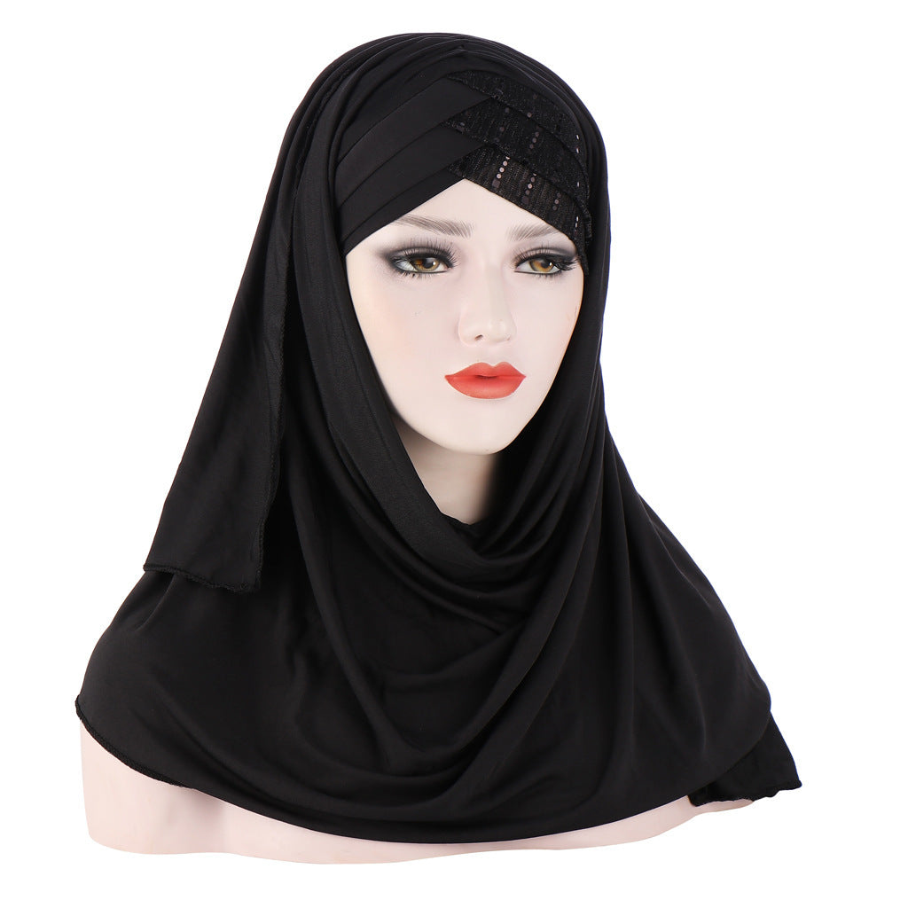 Black hijab on a mannequin head with a white background