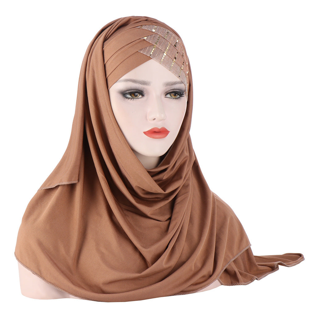 Brown hijab on a mannequin head with a white background