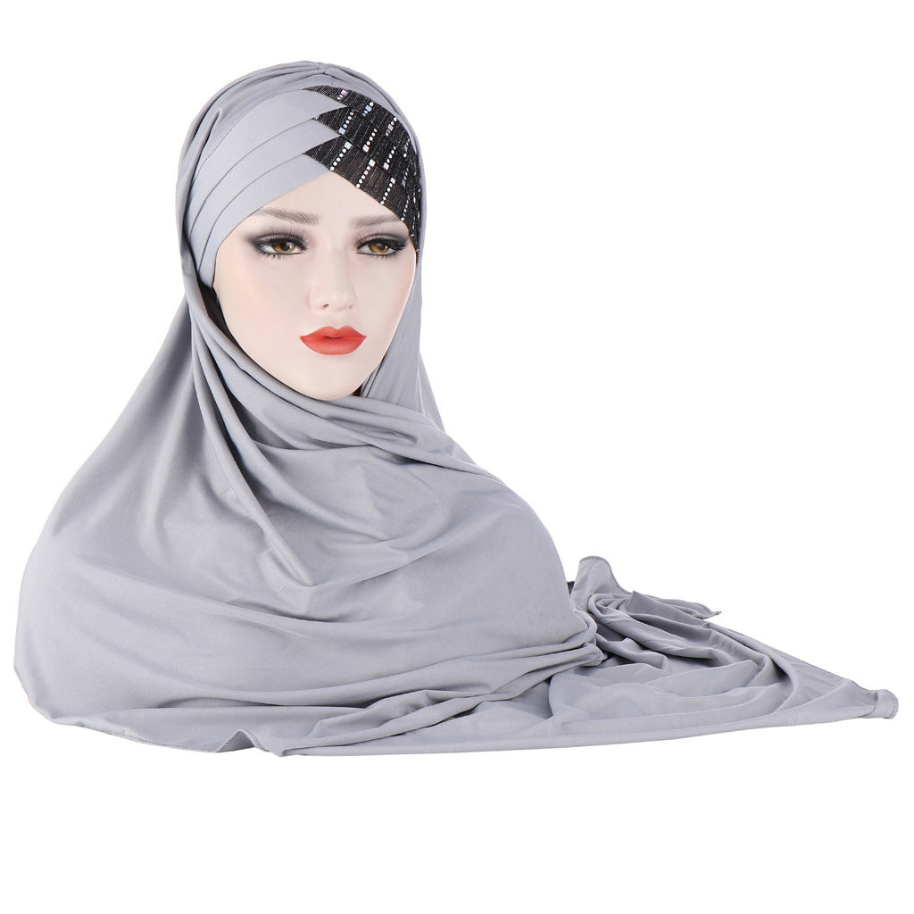 Gray hijab with a decorative headband on a white background