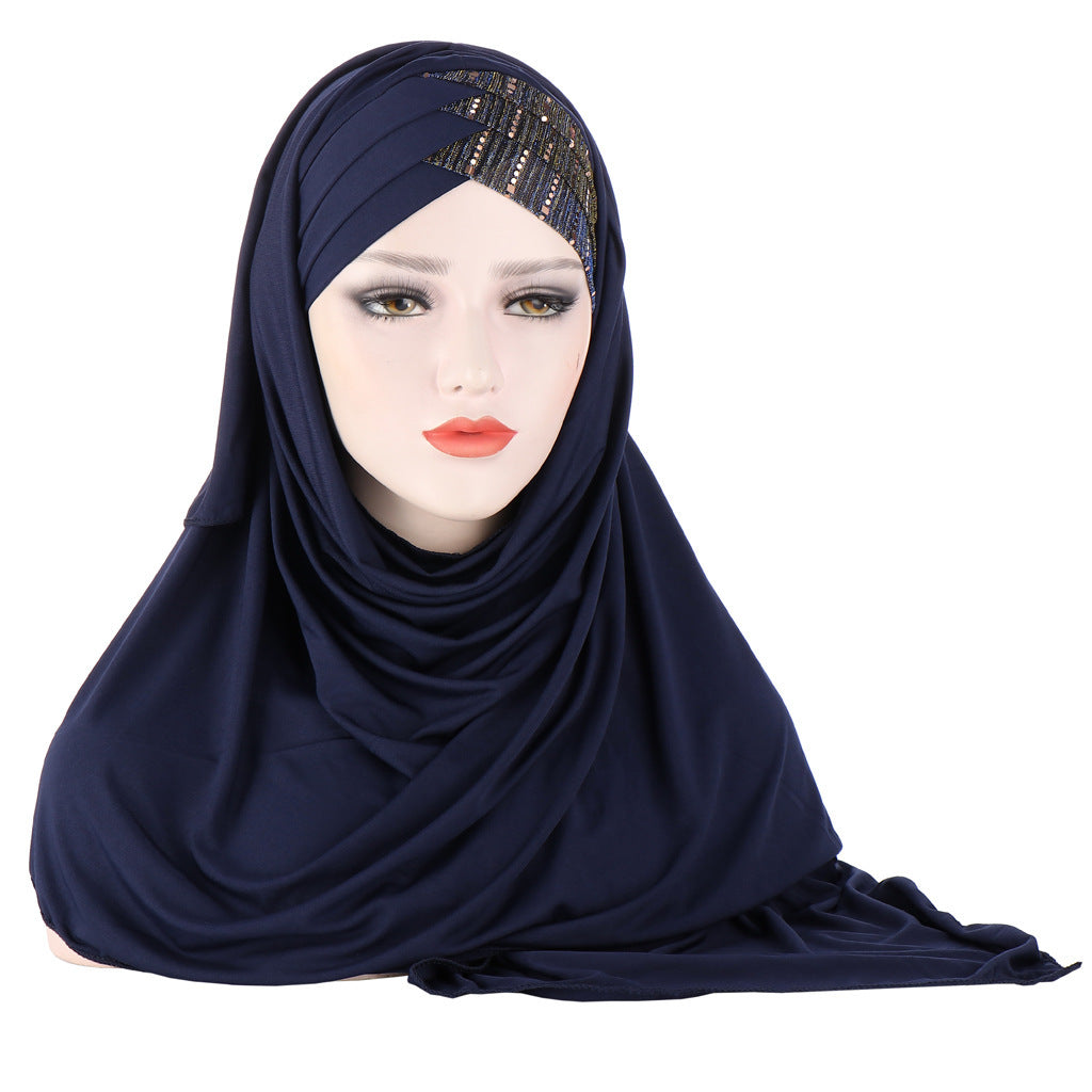 Navy blue hijab on a mannequin head with a white background