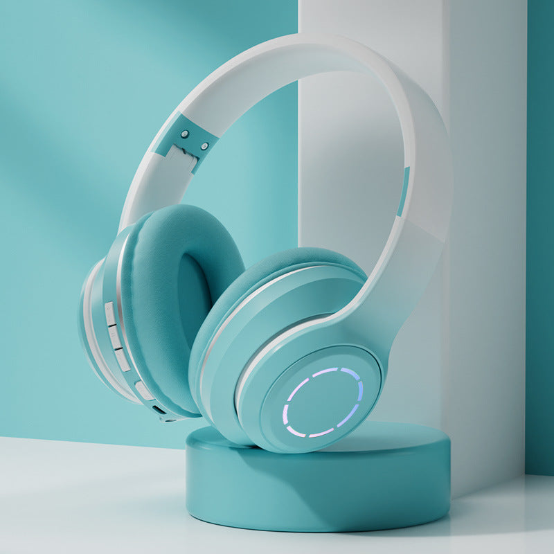 White and light blue headphones on a turquoise stand against a light blue background