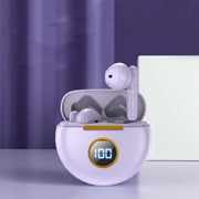 White wireless earbuds in a charging case with a digital display on a purple background