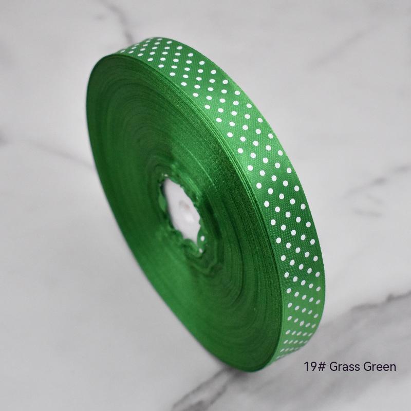 Handmade decorative bows featuring classic polka dot patterns on premium grosgrain ribbon for gift wrapping and accessories 
