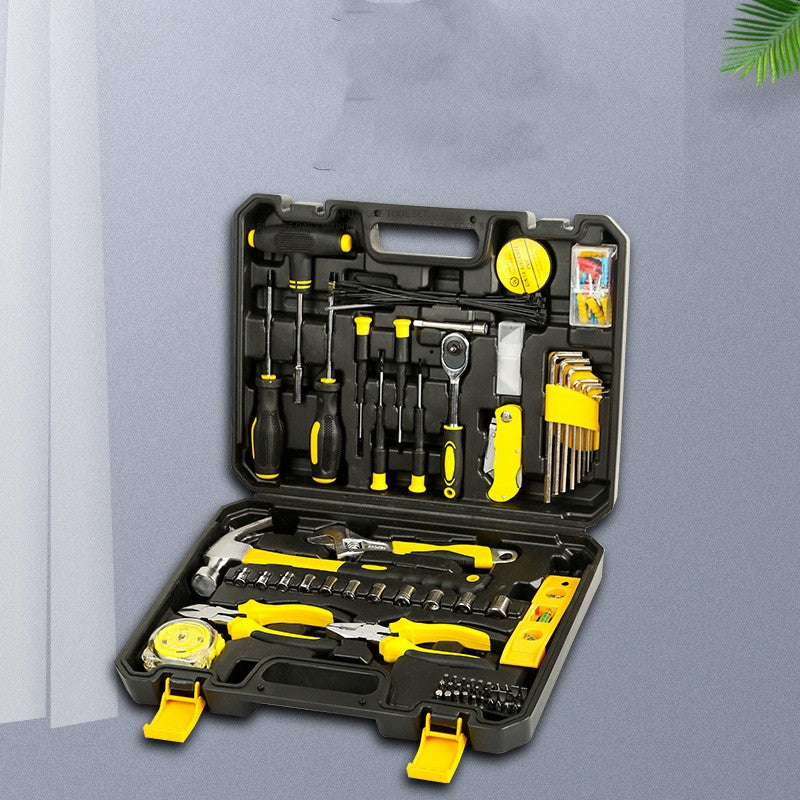 Open tool kit with various tools on a gray background