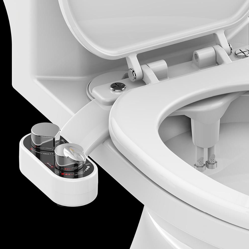 Close-up of a toilet seat with a water tank attachment on a black background