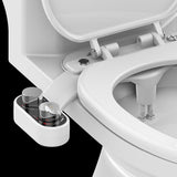 Close-up of a toilet seat with a water tank attachment on a black background