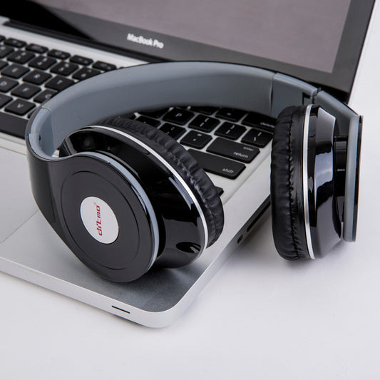 Black headphones on a MacBook Pro