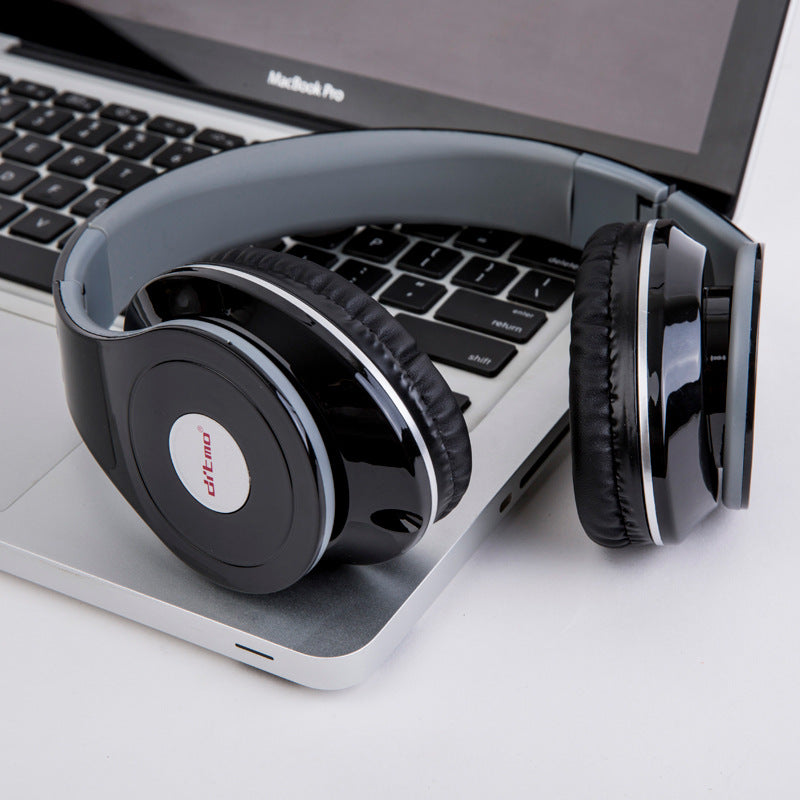 Black headphones on a MacBook Pro