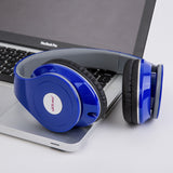 Blue headphones on a laptop with a visible brand logo