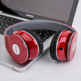 Red and black headphones on a laptop