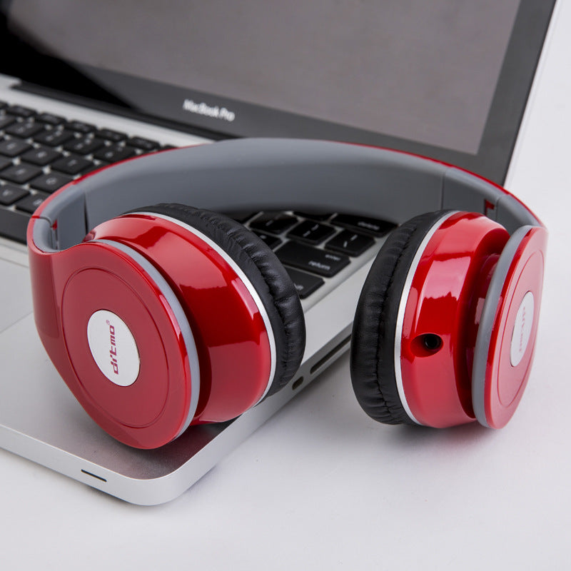 Red and black headphones on a laptop