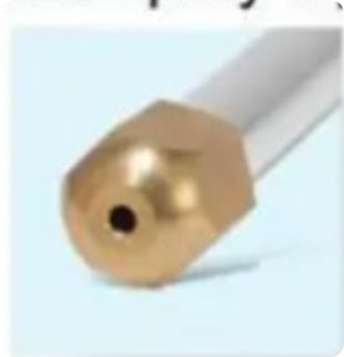 Close-up of a brass nozzle on a white background