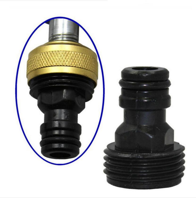 Black and gold garden hose fitting on a white background