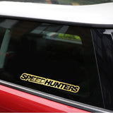 Yellow 'SPEEDHUNTERS' decal on a car window